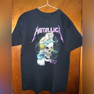 Metallica band t shirt. Size medium fits closer to a large.